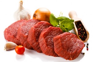 Raw beef and vegetables on white background